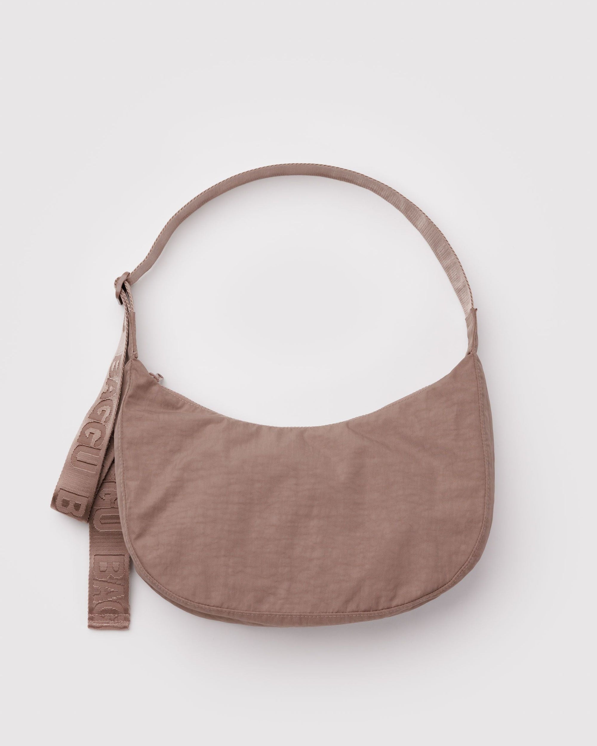 Baggu Medium Nylon Crescent Bag in muted rose-taupe toasted almond color on white background