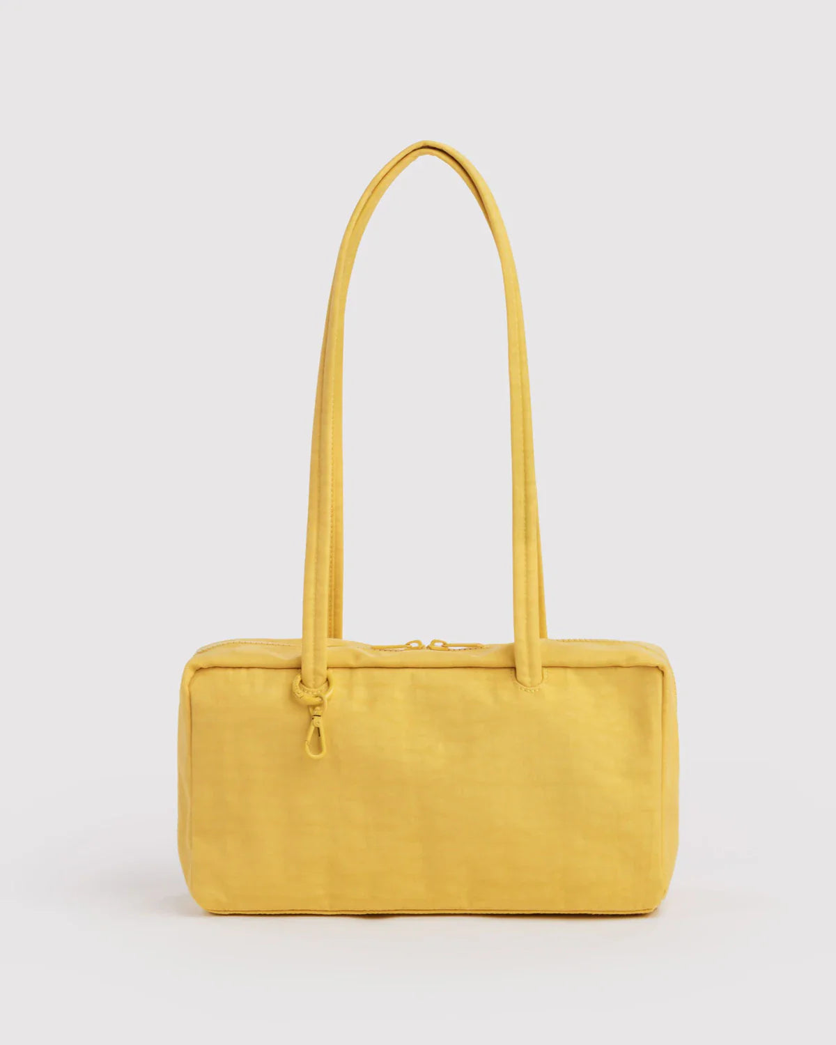 Baggu Nylon Bowler Bag in sunflower yellow with long shoulder strap on white background