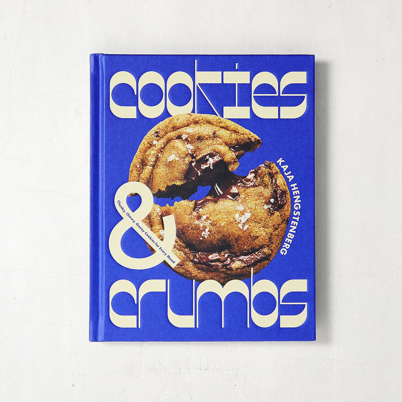 Book titled 'Cookies & Crumbs' with a blue cover featuring images of cookies on a white background