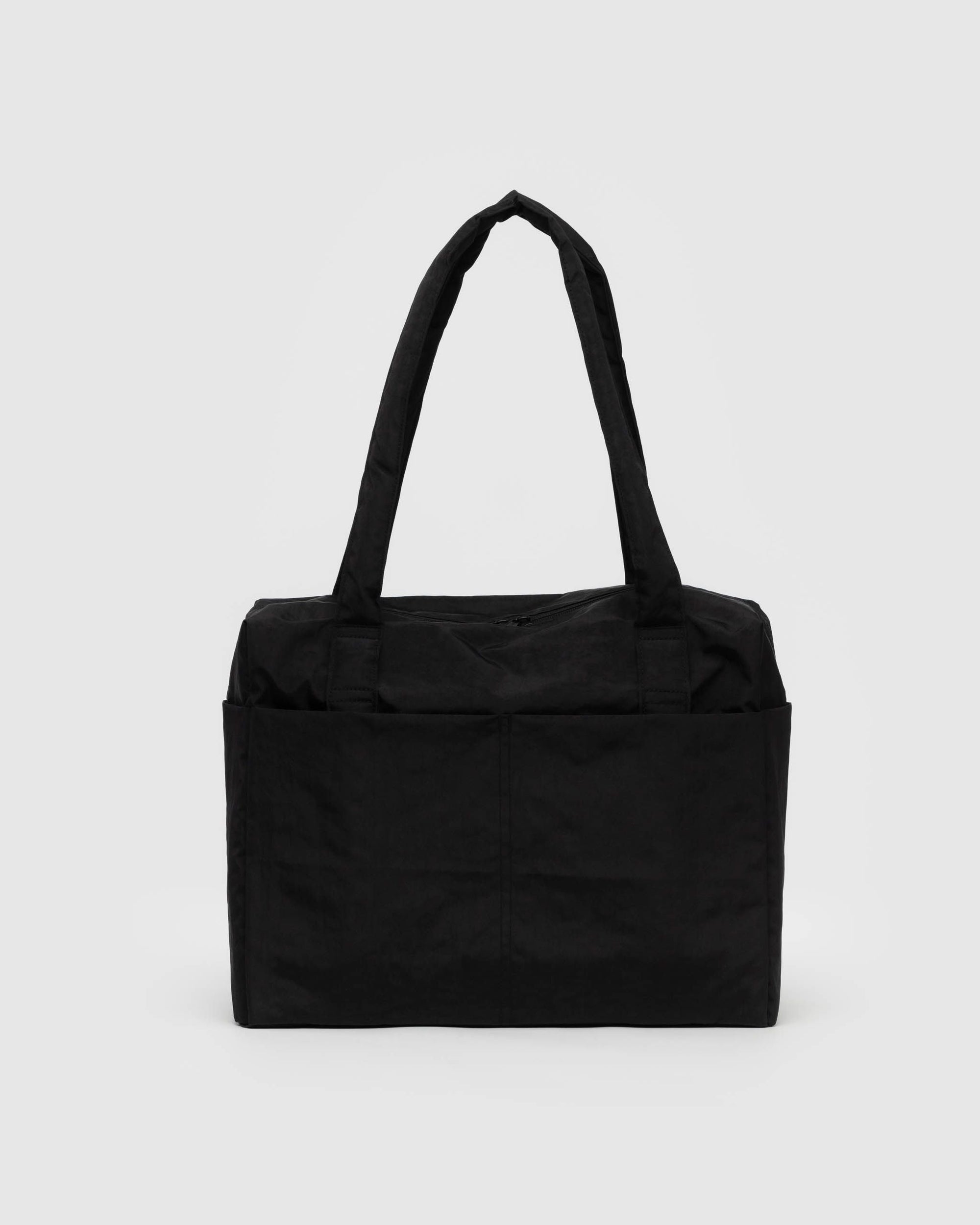 Black quilted carry-on bag with laptop pocket and shoulder straps on white background