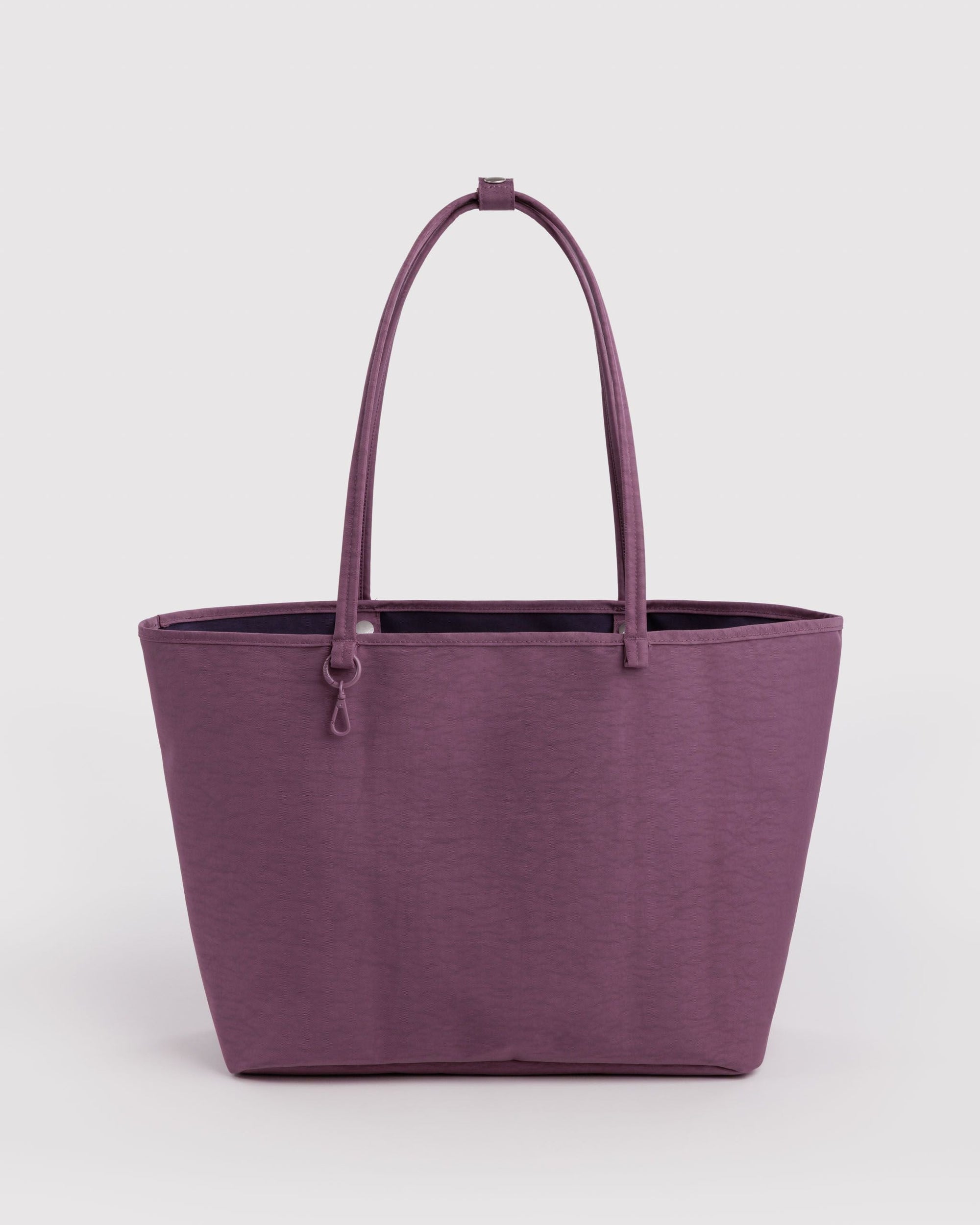 Large structured nylon tote bag in dusty purple with long shoulder straps and snap closure