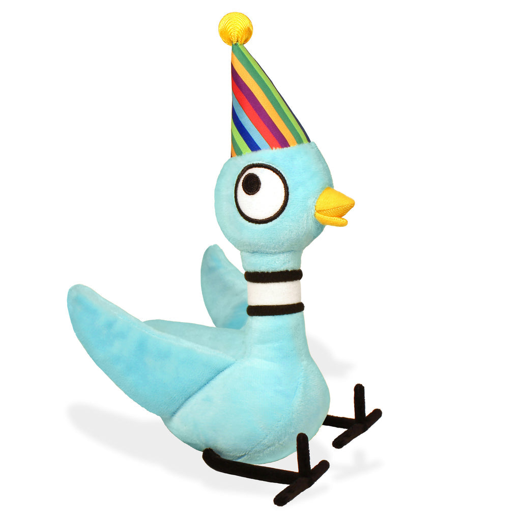 Light blue pigeon plush toy wearing a rainbow striped birthday party hat with yellow beak