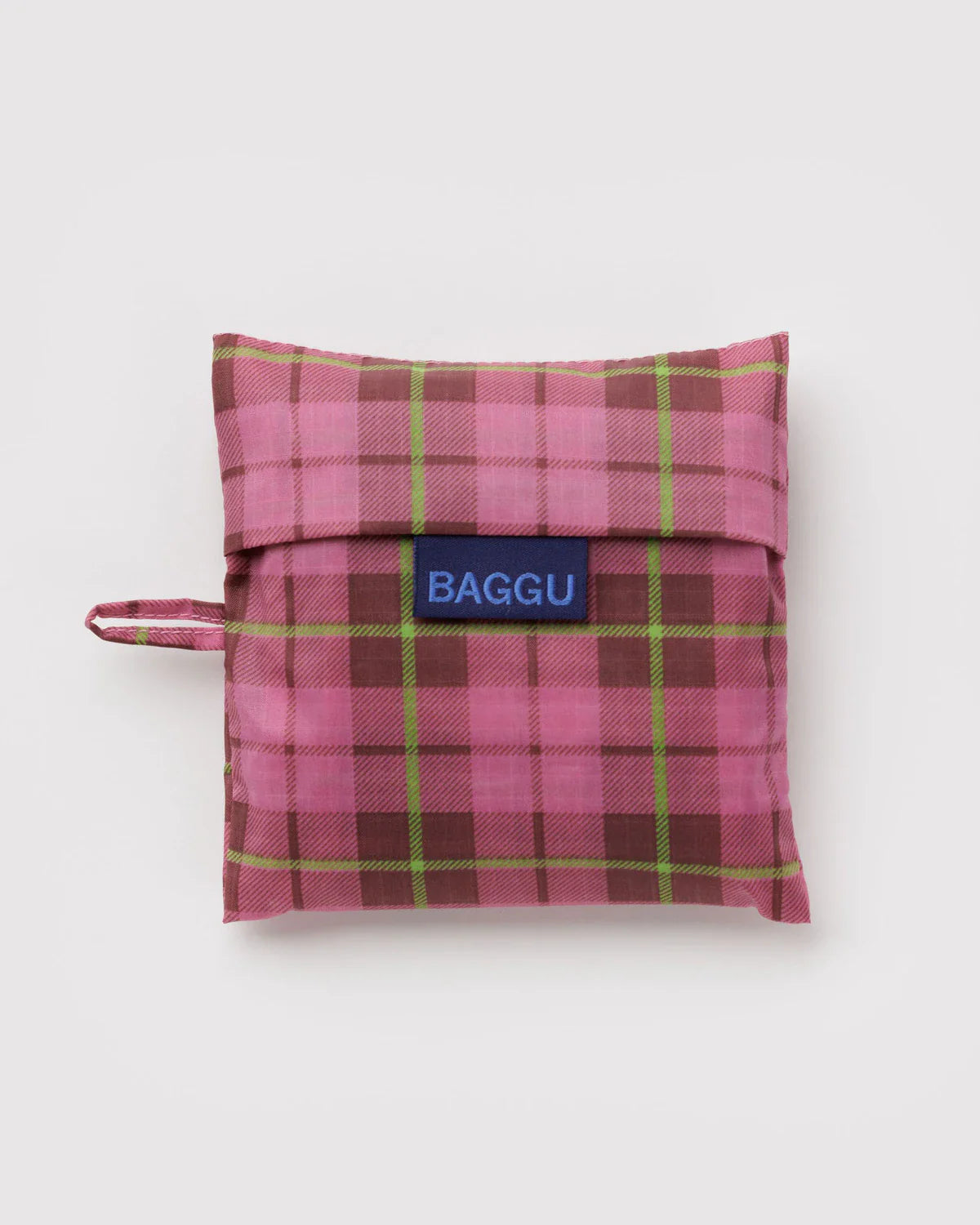 Standard Baggu reusable bag folded into pink tartan plaid pouch with navy logo label