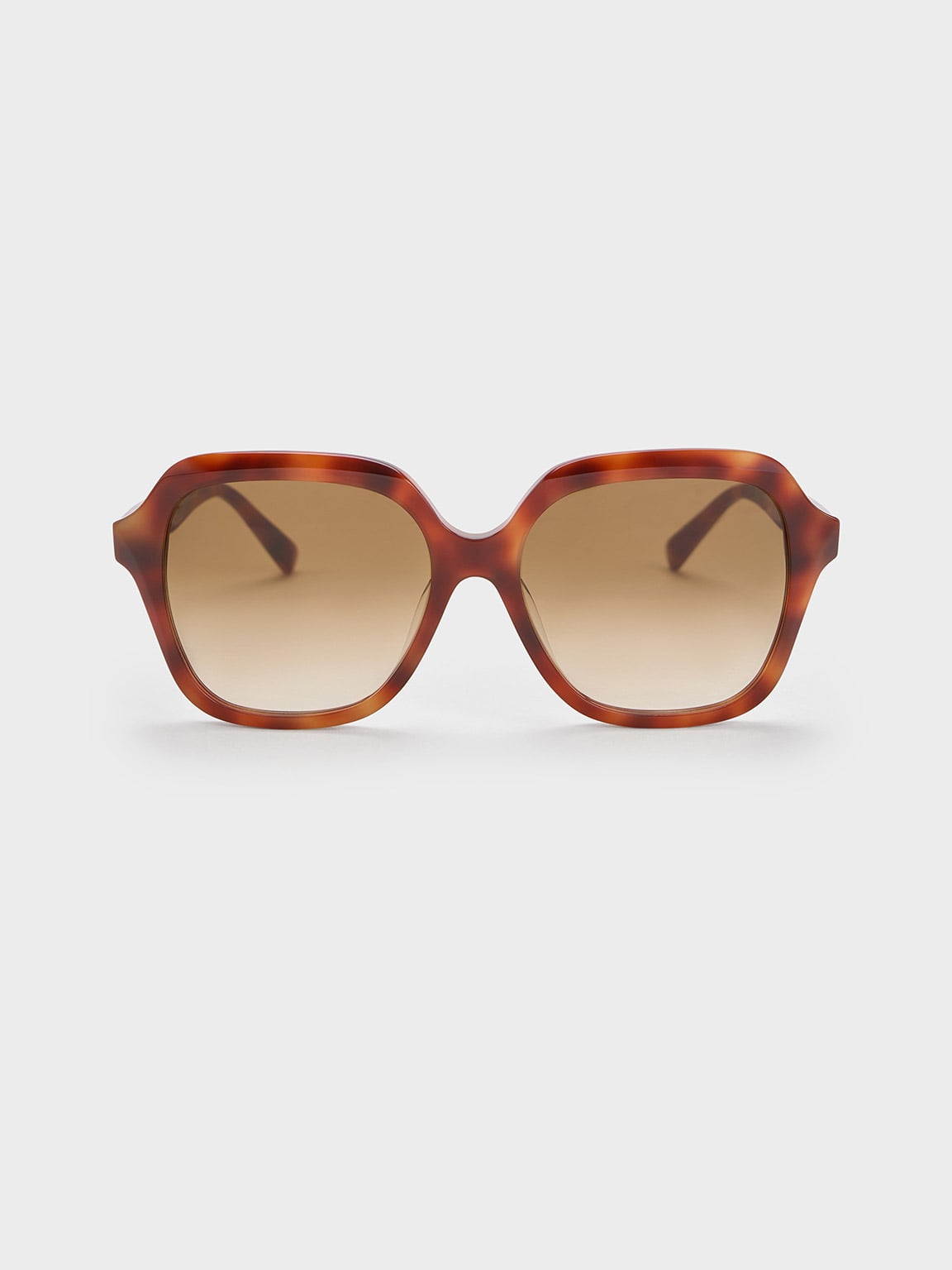 Wide square frame sunglasses in tortoise shell pattern with gradient brown lenses