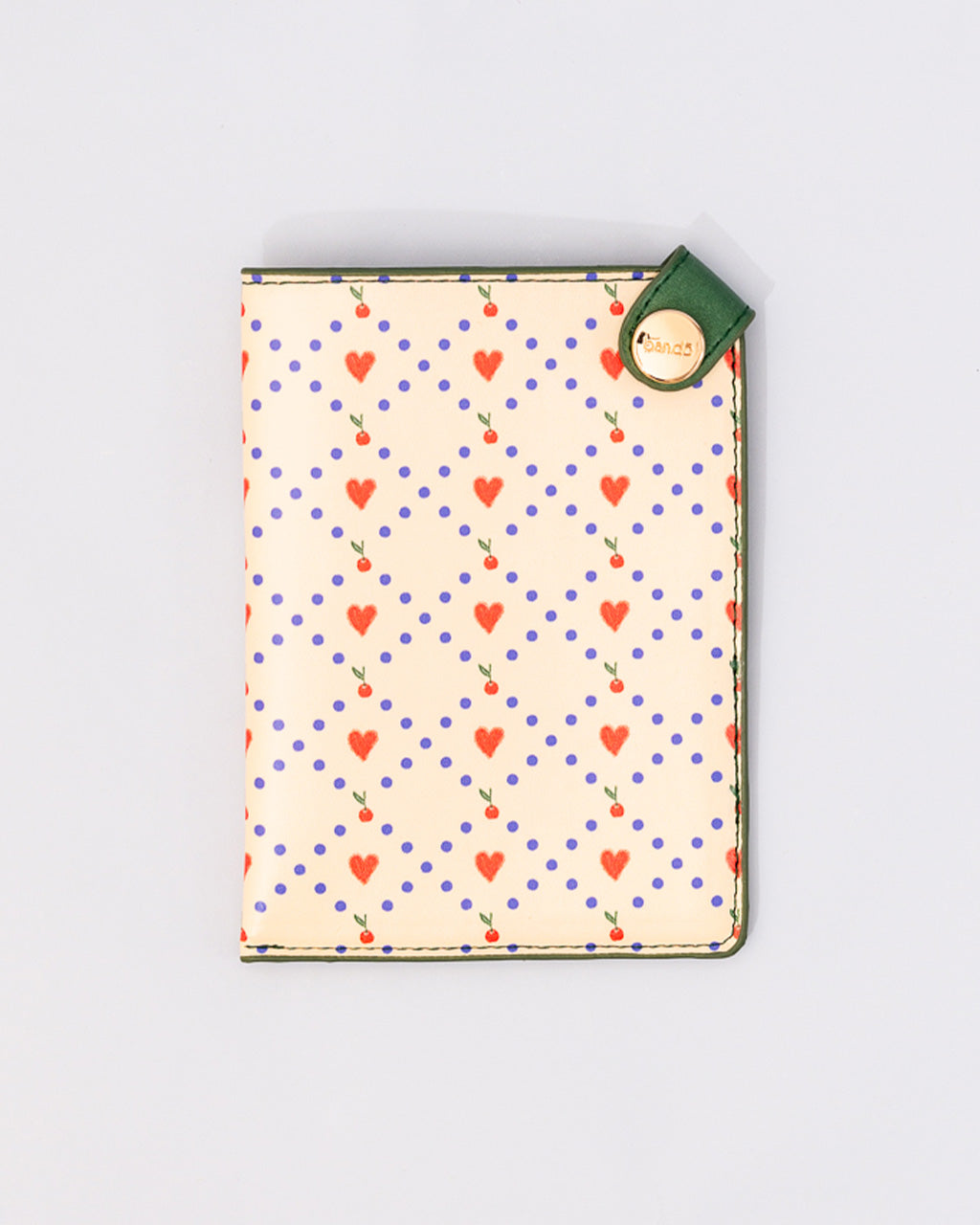 Ban.do Cherry Hearts passport holder in cream with red hearts, cherries, purple polka dots, and green trim with gold snap ...