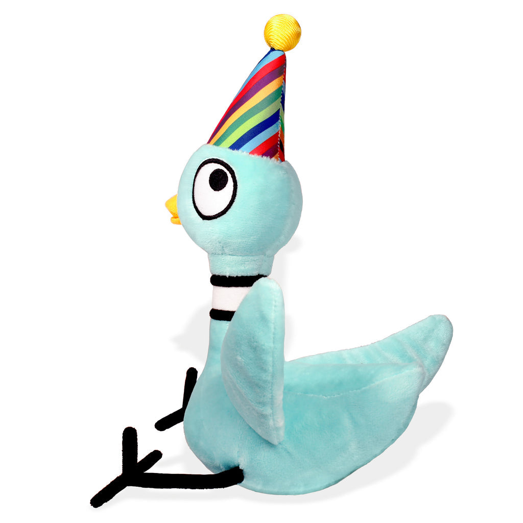 Light blue pigeon plush toy wearing a rainbow striped birthday party hat with yellow pompom