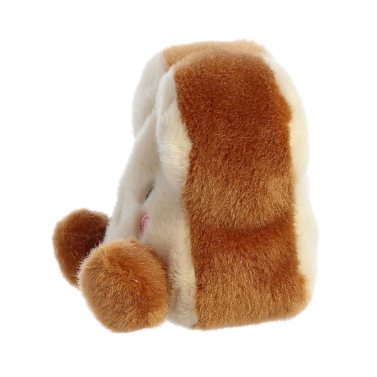 Side view of Aurora Buttery Toast plush showing brown crust edge and round hand