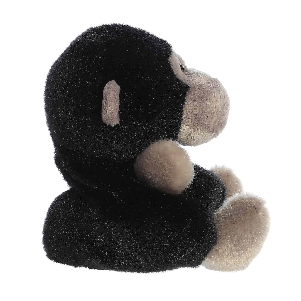 Side profile view of Aurora Gunga Gorilla plush toy with black and tan coloring
