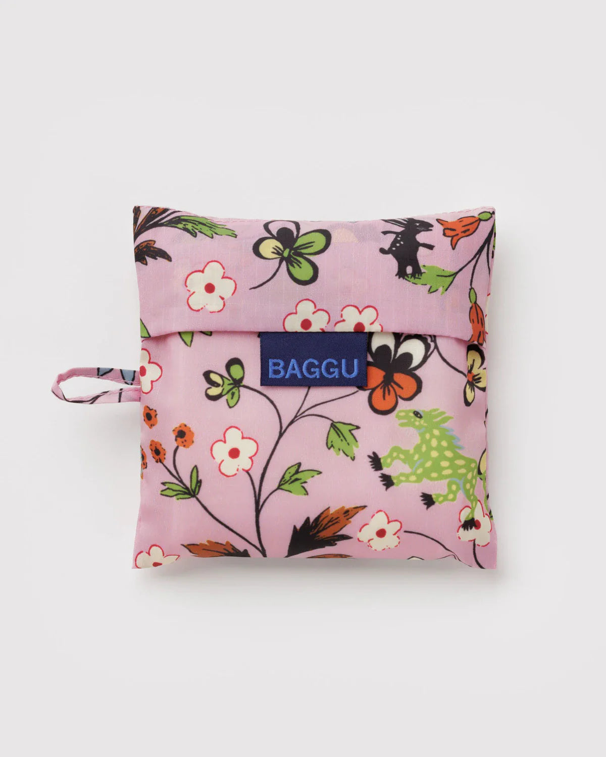 Baggu Standard reusable bag folded into pink pouch with castle creatures floral print