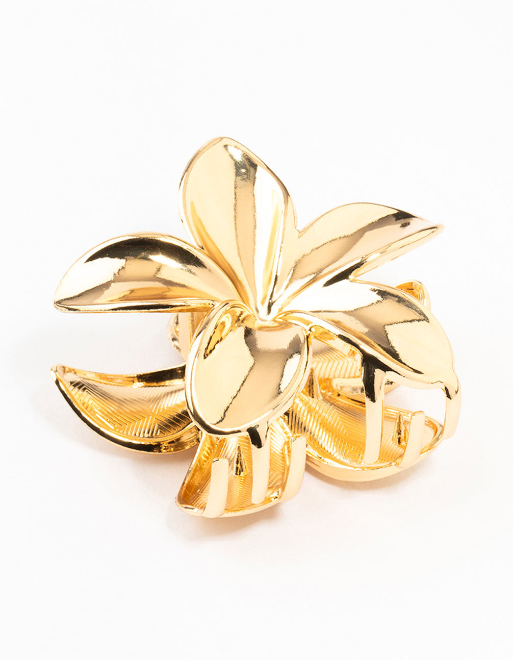 Gold flower-shaped hair claw clip with shiny metallic finish on white background