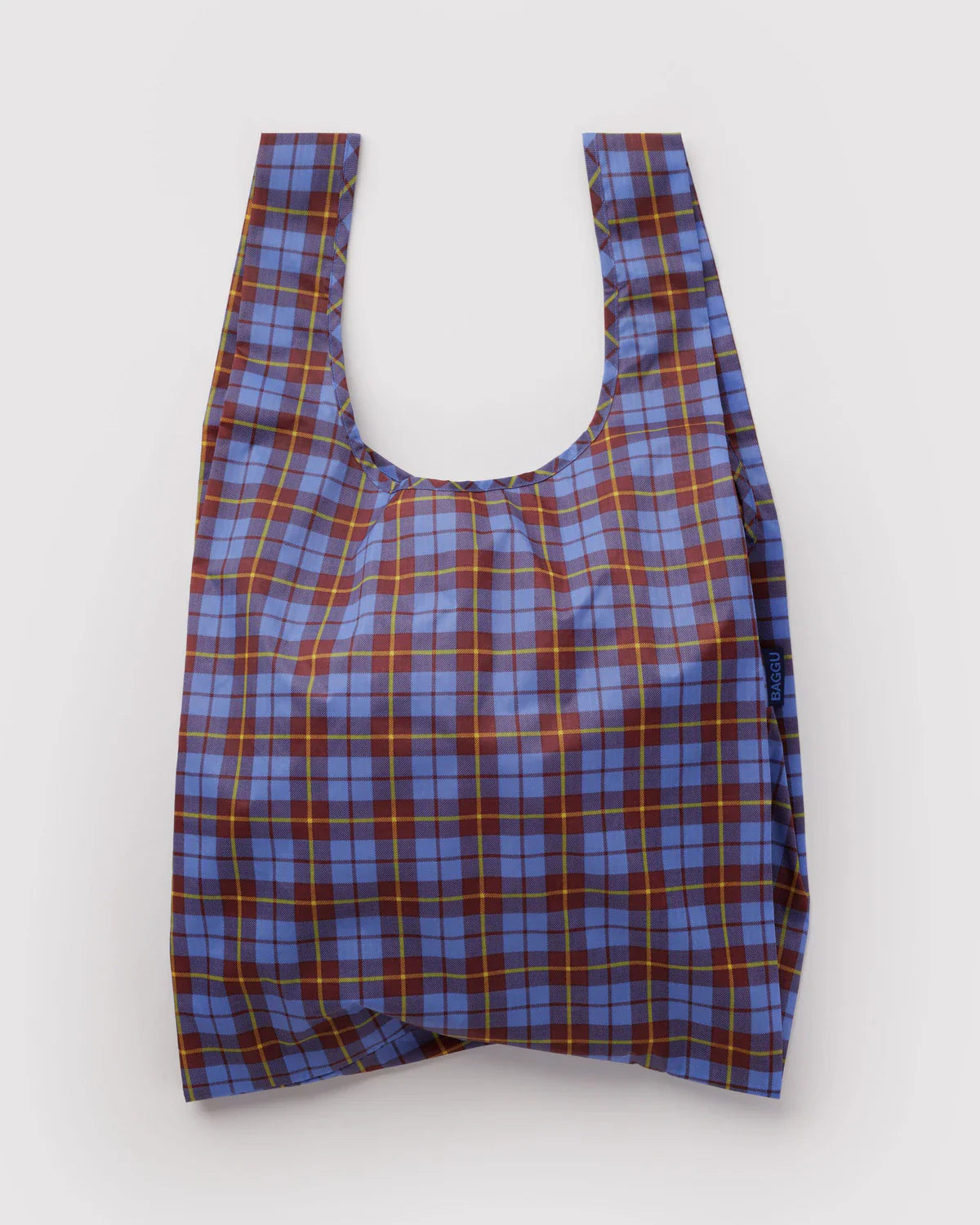Baggu Standard reusable tote bag in blue and brown tartan plaid pattern with yellow-green accents