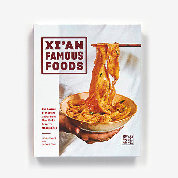 Book cover of 'XXán Famous Foods' with a bowl of noodles on a white background