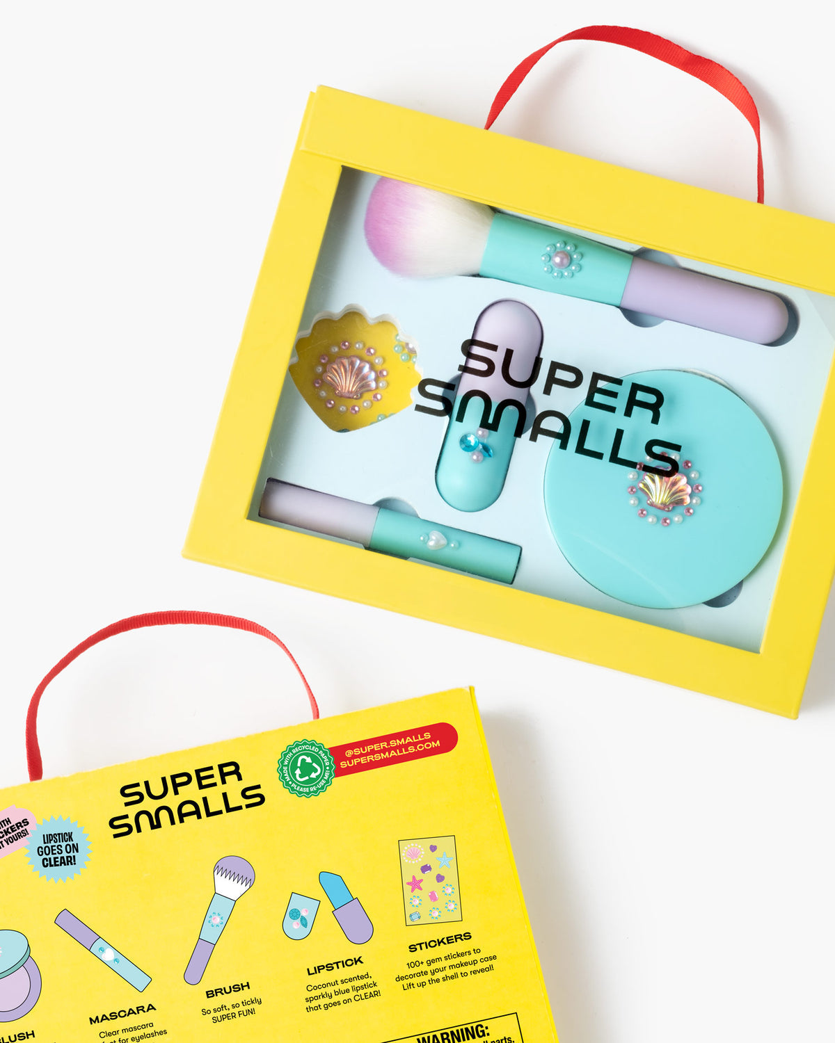 Super Smalls makeup set with yellow packaging on a white background