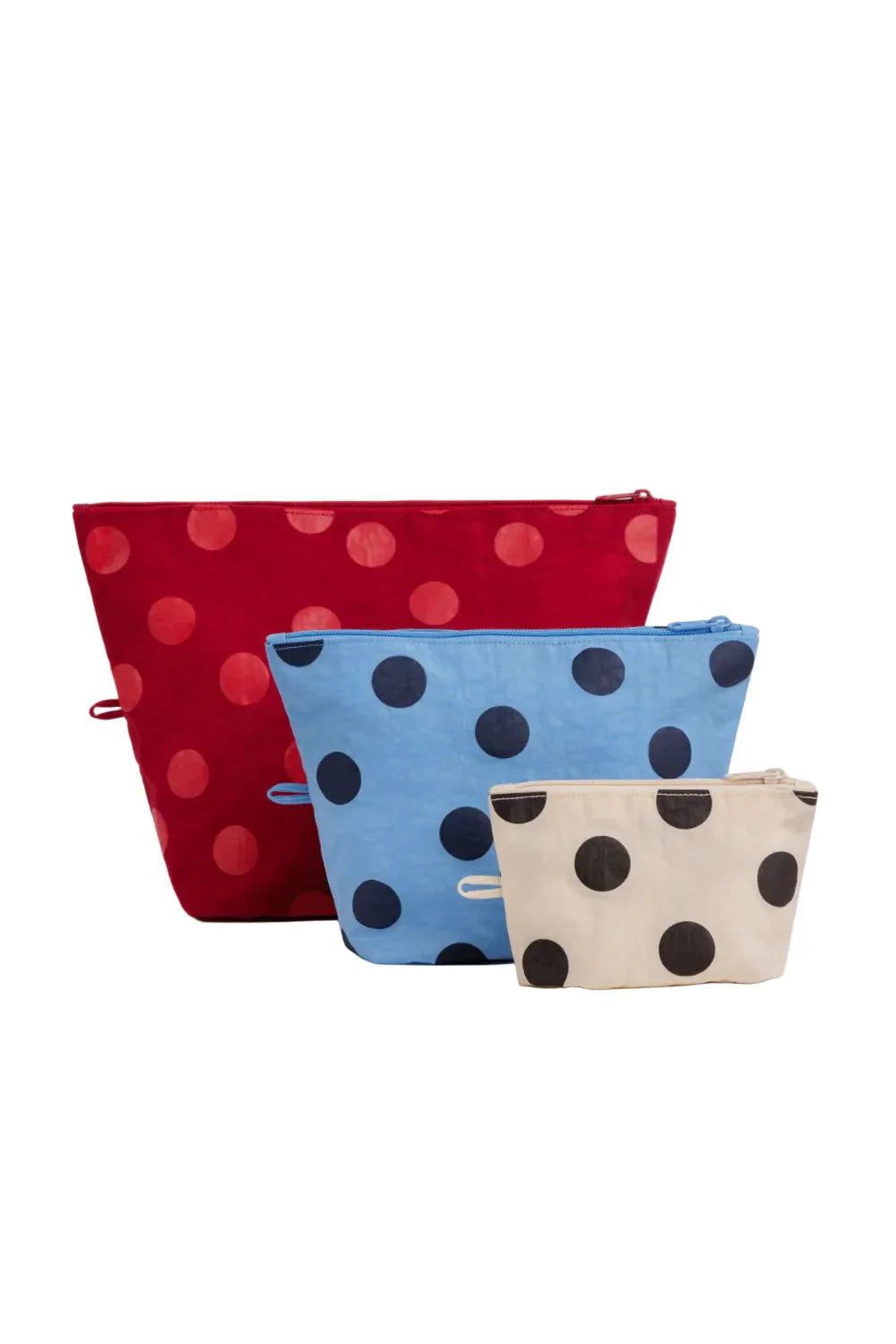 Set of three polka dot zip pouches in red, light blue, and cream, graduated sizes
