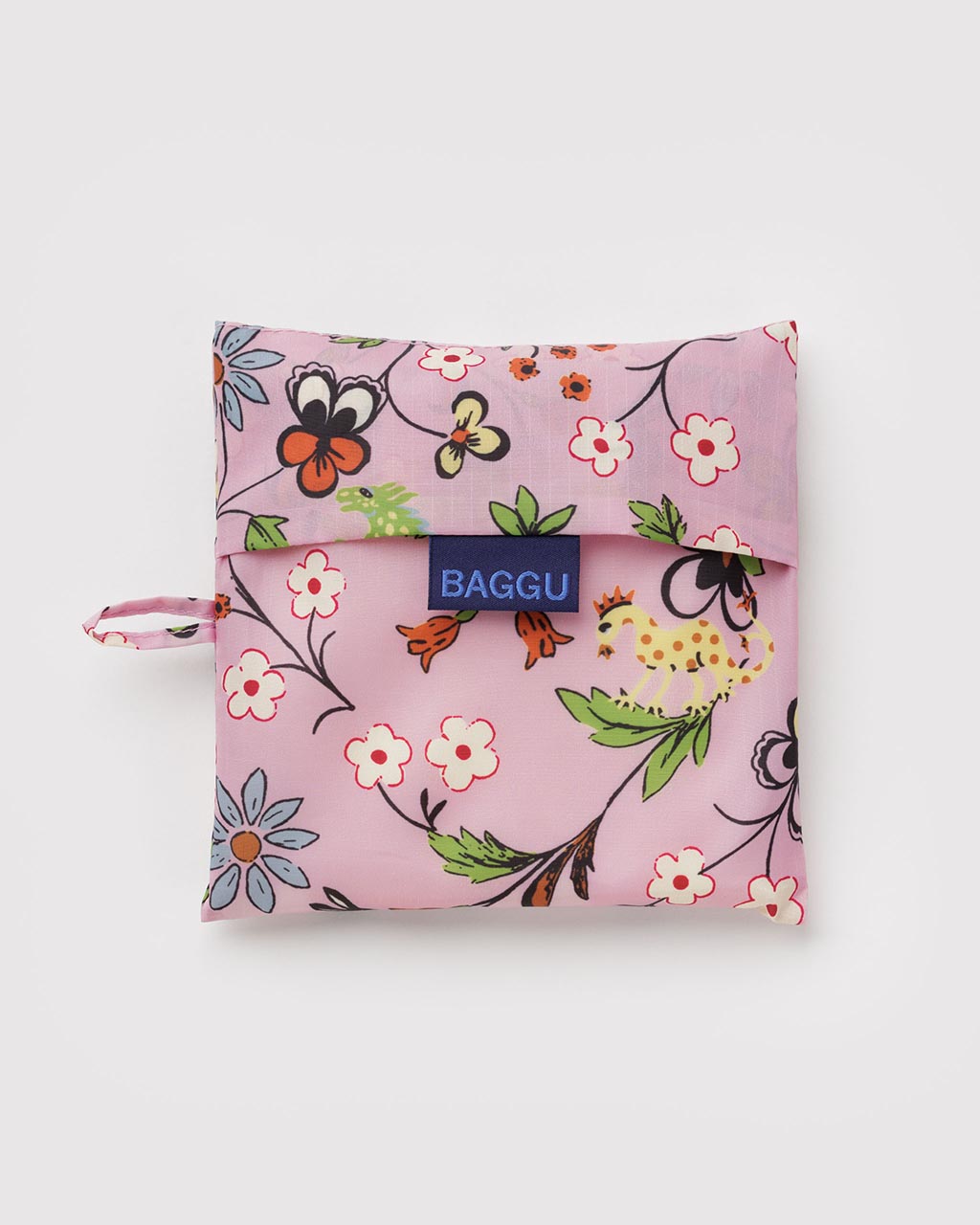 Baggu Big Baggu reusable bag folded into pouch, pink with castle creatures floral print