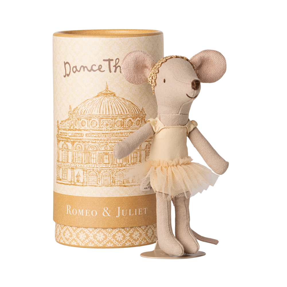 Cream colored Maileg ballet dancer mouse with tulle skirt and golden headband next to decorative tube
