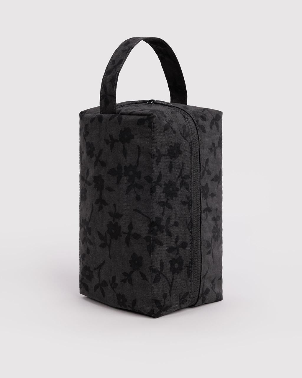 Baggu Dopp Kit in charcoal ditsy floral pattern with top handle and zipper closure