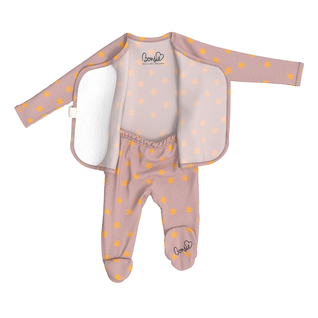 Bonsie skin-to-skin dusty pink footie with gold star pattern and wrap-open front panels