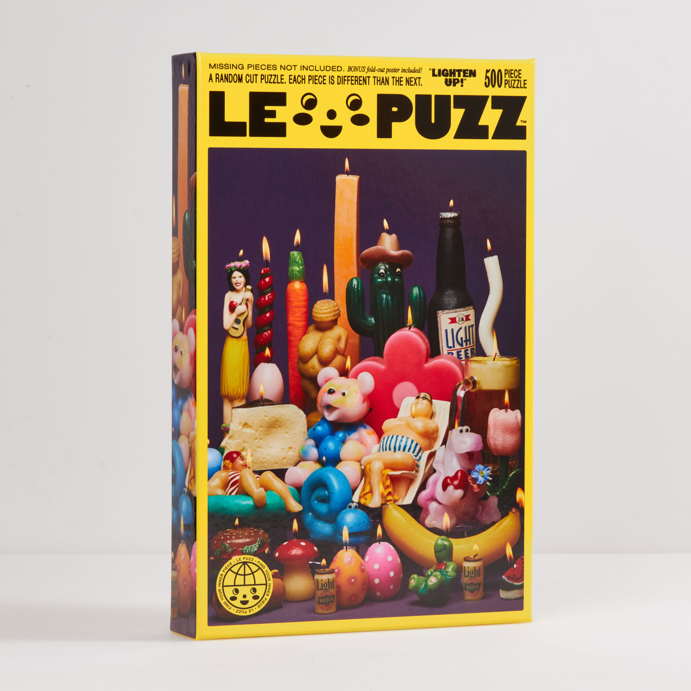 Le Puzz 'Lighten Up' 500-piece puzzle box featuring colorful novelty candles on purple background