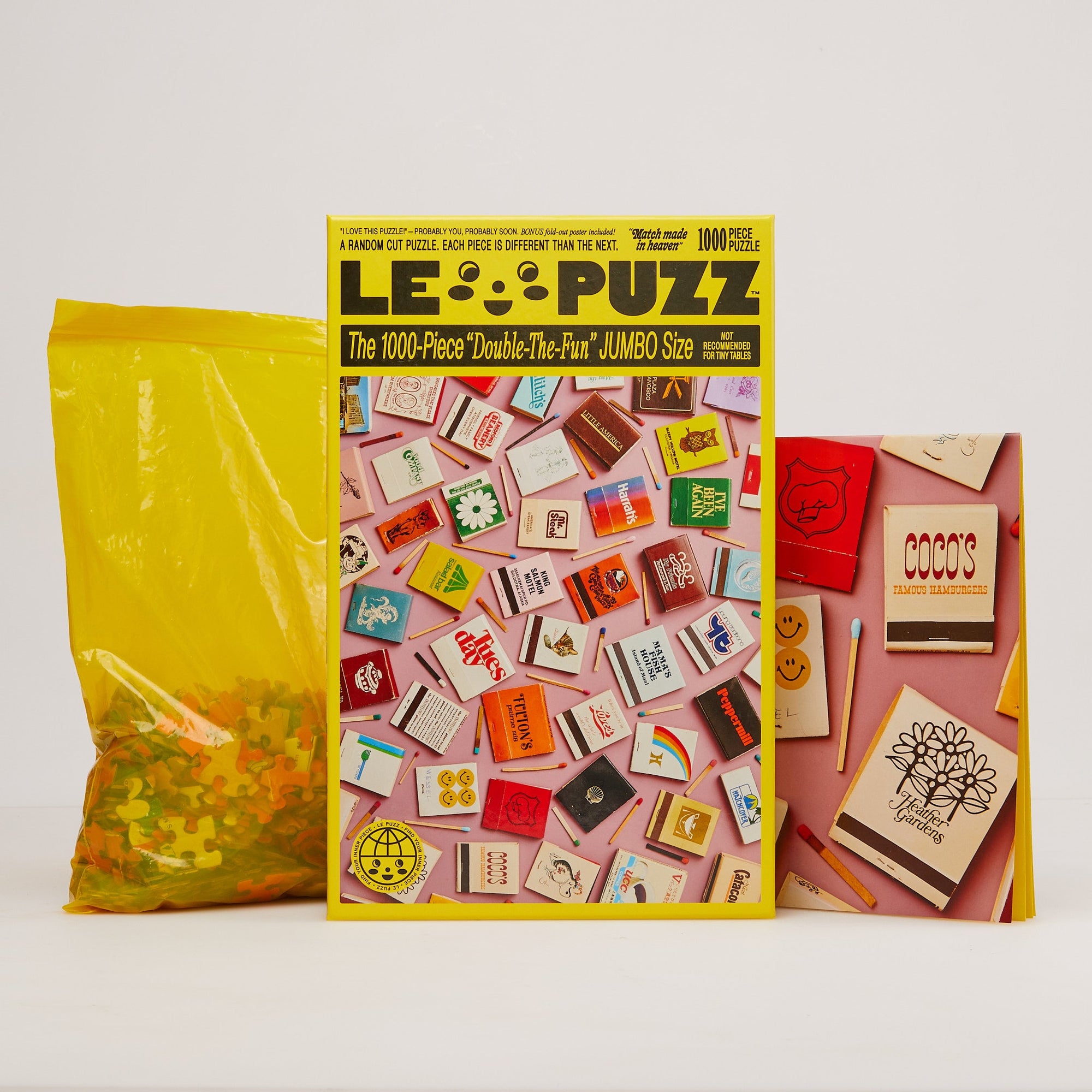 Le Puzz Match Made in Heaven 1000-piece jumbo puzzle box with matchbook artwork, puzzle pieces bag, and poster