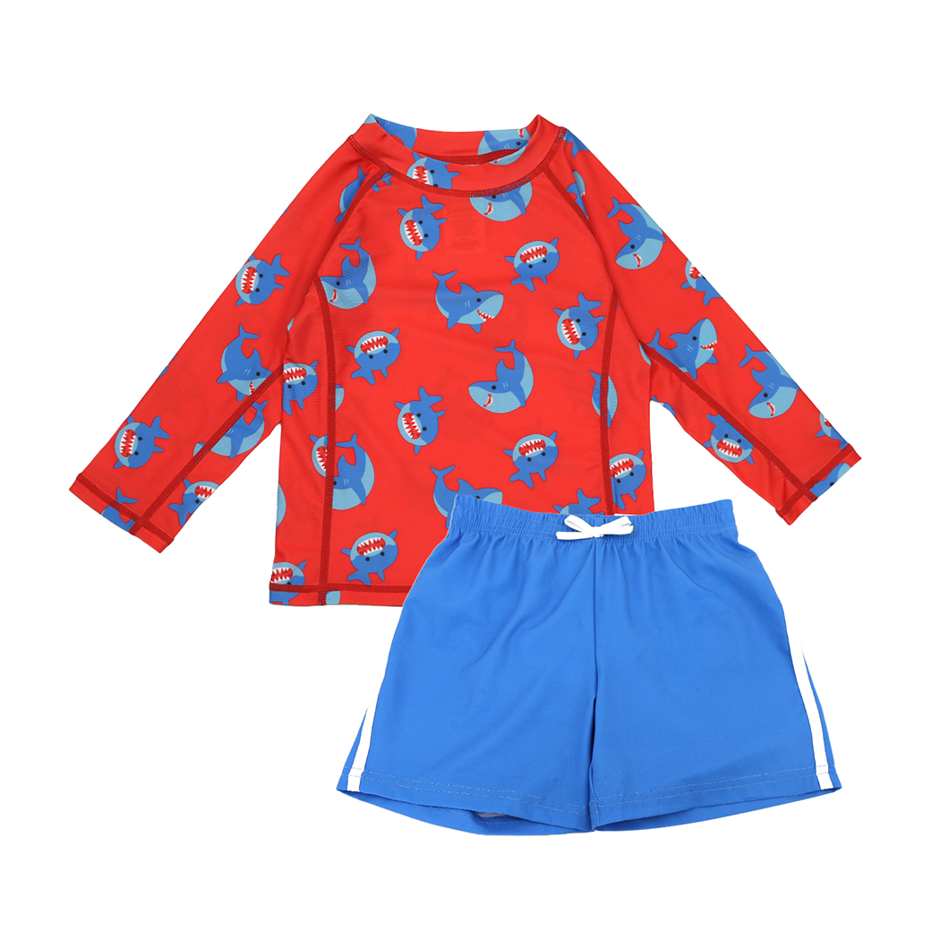 Red long-sleeve rashguard with blue shark print and solid blue swim shorts set