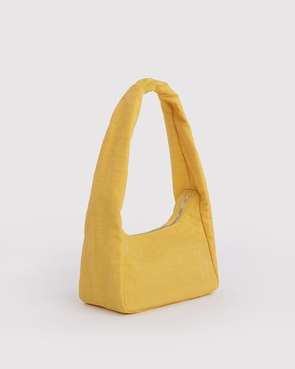 Baggu Small Nylon Meringue Bag in sunflower yellow with twisted shoulder strap and silver zipper