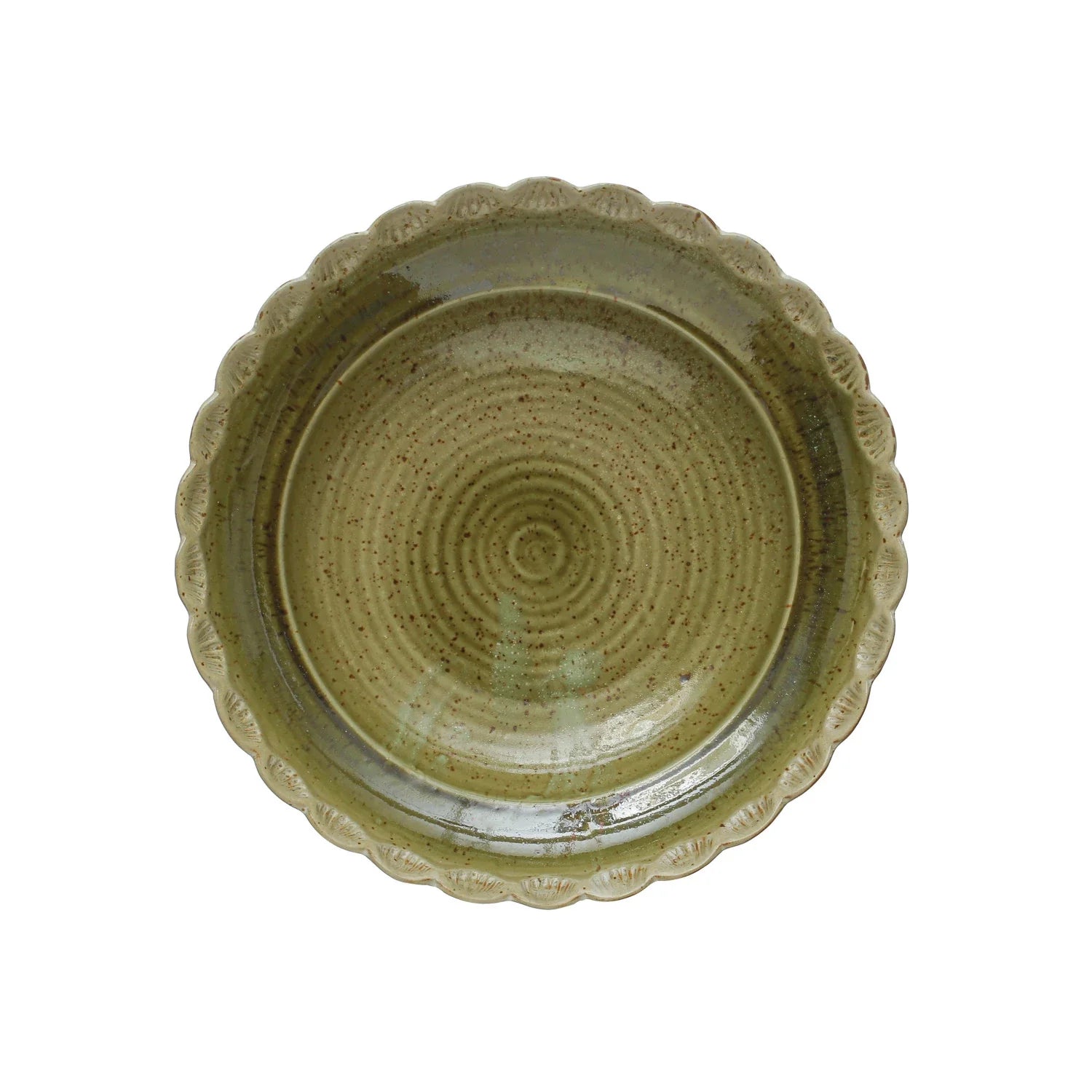 Green glazed stoneware bowl with scalloped decorative rim viewed from above