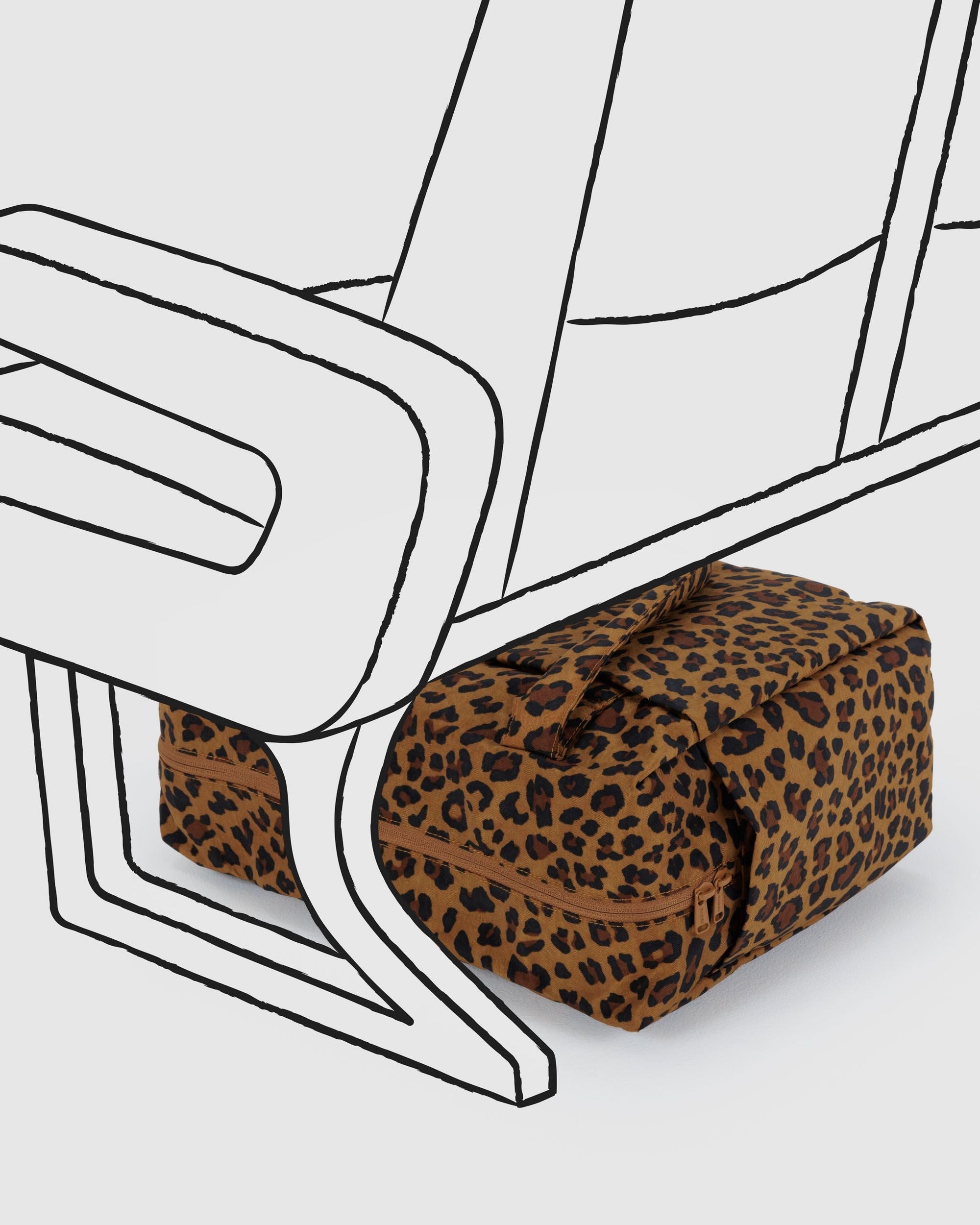 Leopard print carry-on bag with zipper positioned near stylized line drawing of chair