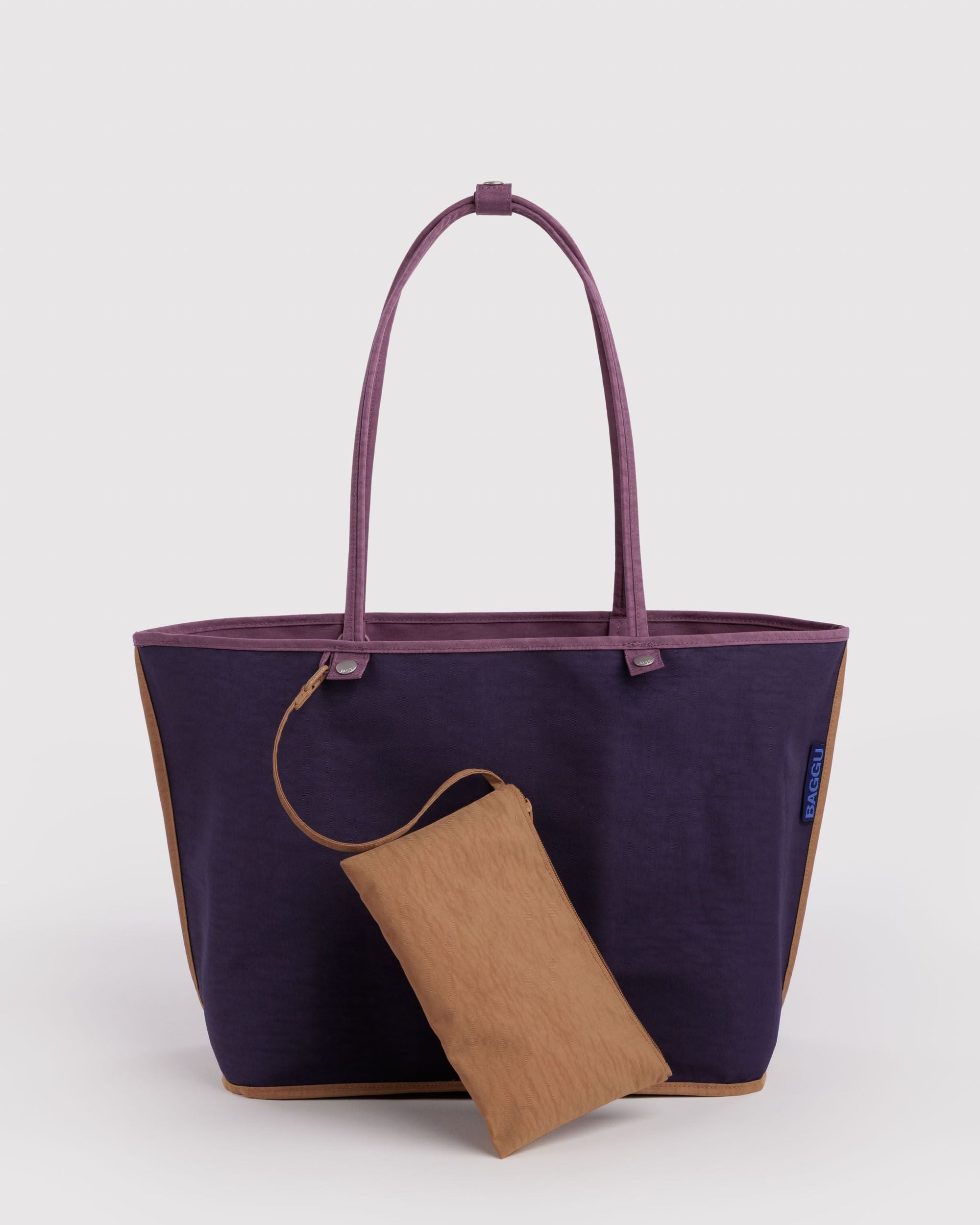 Baggu large nylon reversible tote in deep purple with tan trim and matching pouch