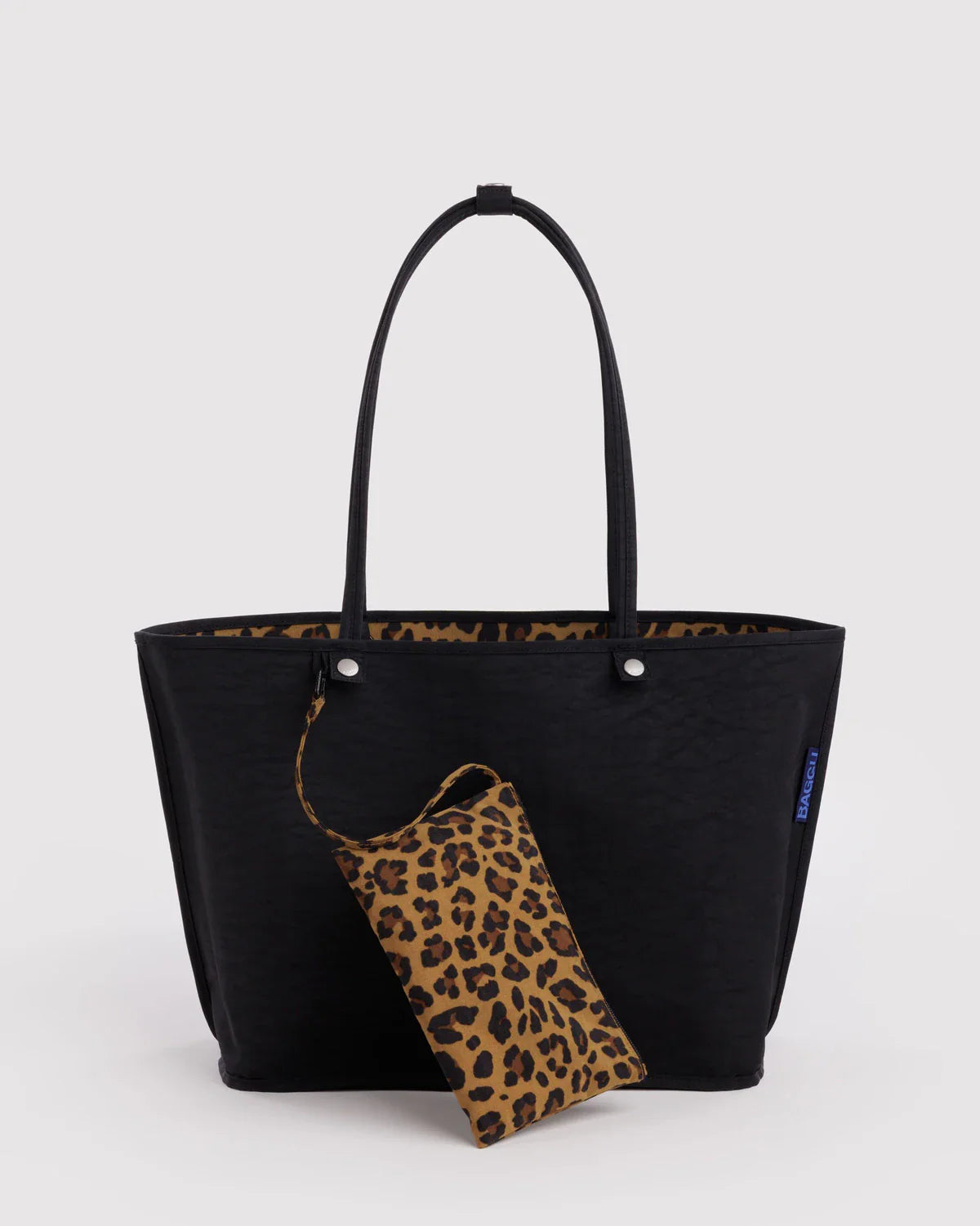 Baggu large black nylon reversible tote bag with leopard print interior and matching pouch