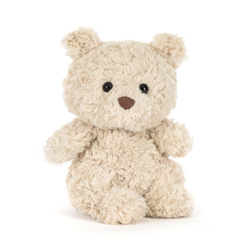 A cream-colored curly plush teddy bear with black bead eyes and a brown stitched nose