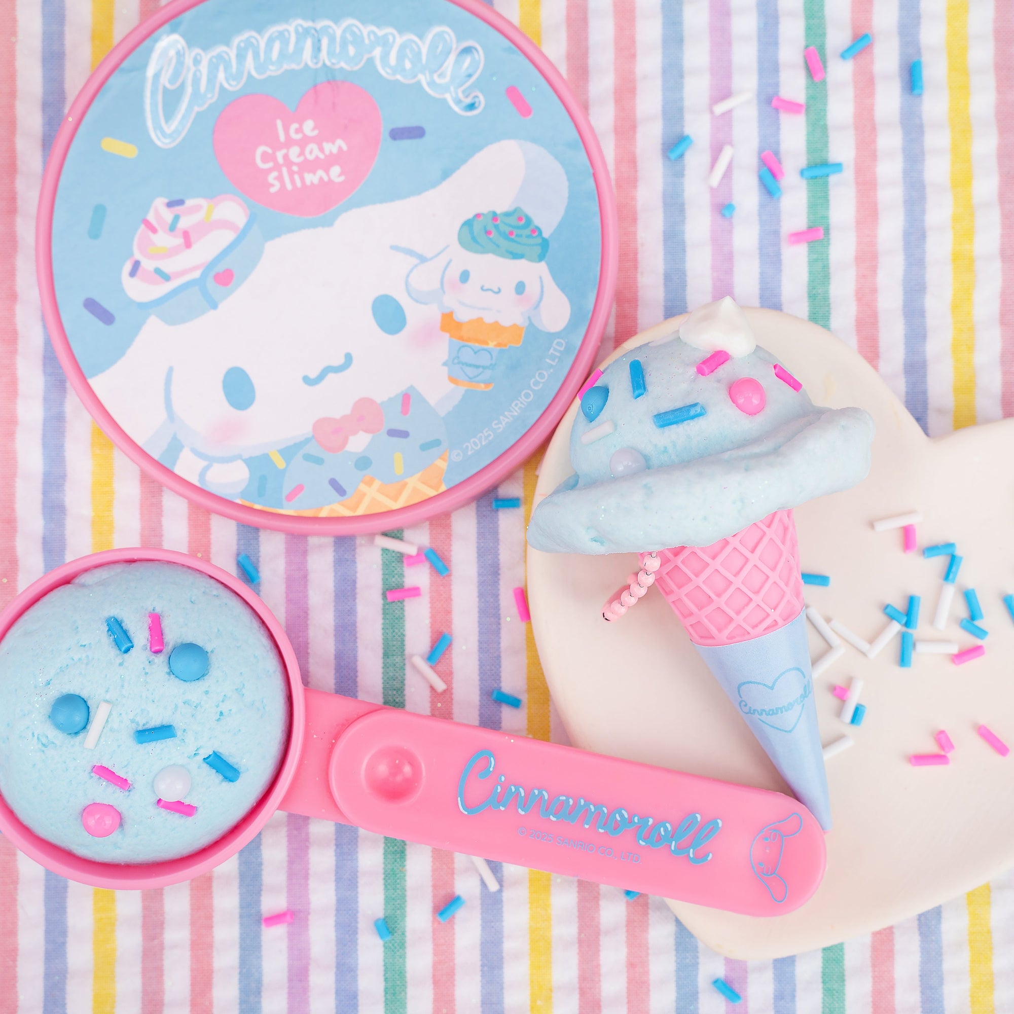 Cinnamoroll Ice Cream Slime Kit with blue slime, pink cone, scoop tool, and decorative sprinkles