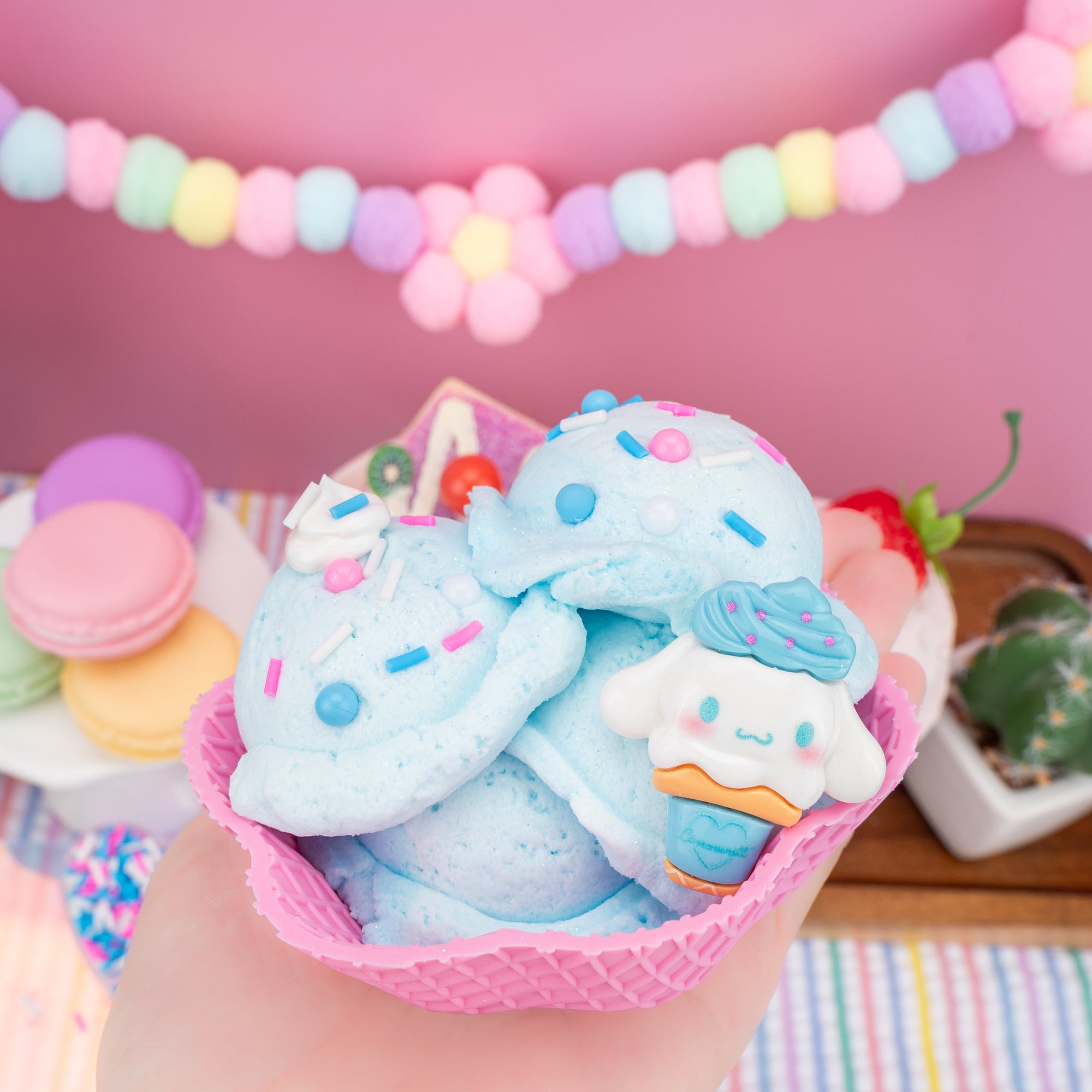 Cinnamoroll-themed light blue ice cream slime in pink waffle bowl with sprinkles and character figurine