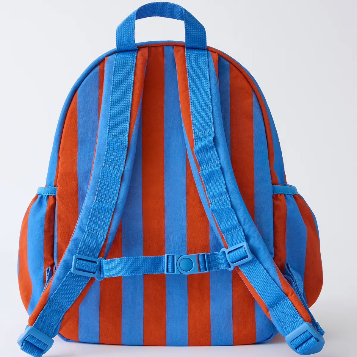 Back view of blue and rust striped kids backpack with adjustable blue shoulder straps and buckle