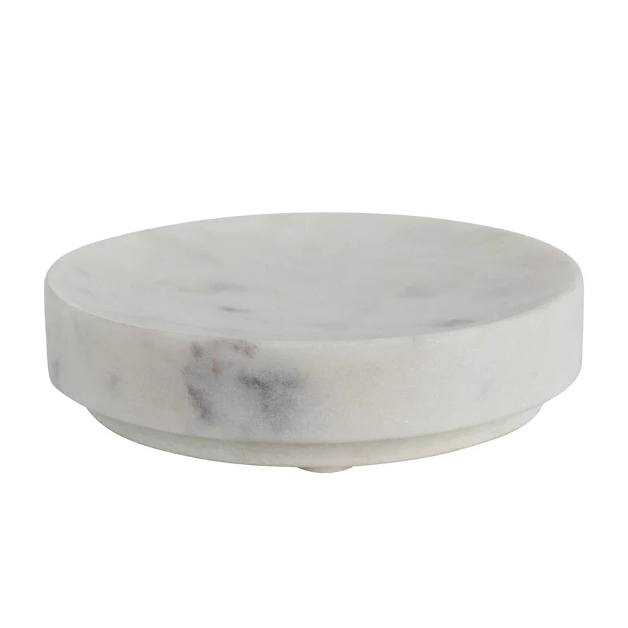 Round white marble soap dish with natural gray veining on white background