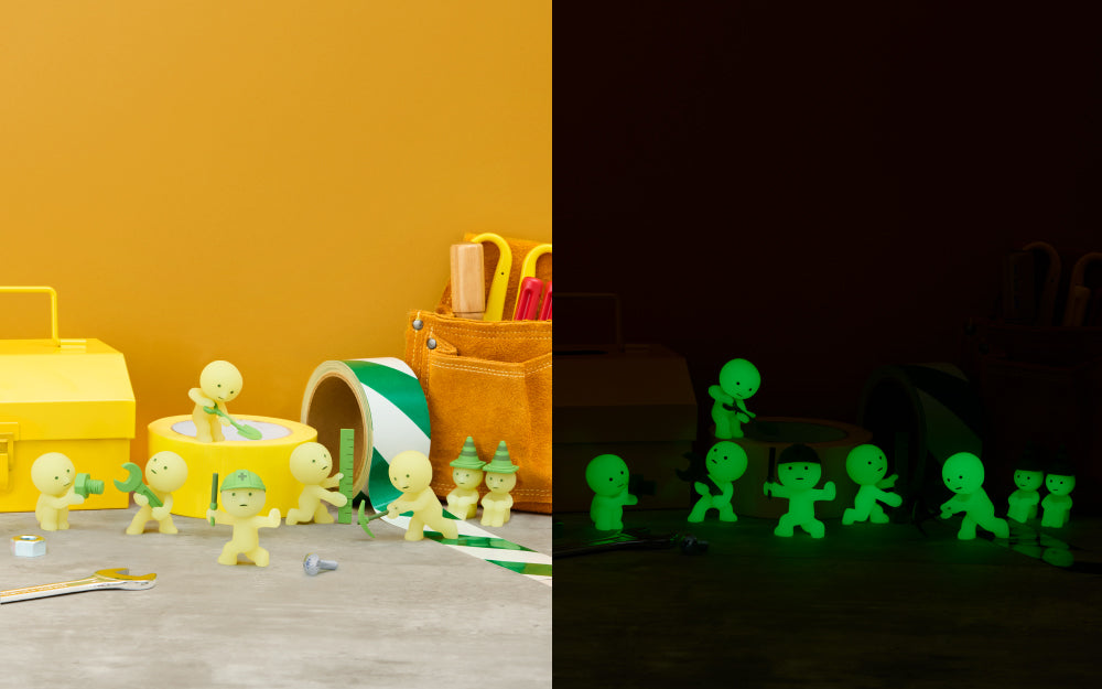 SMISKI Construction Series minifigures shown in light and glowing green in dark