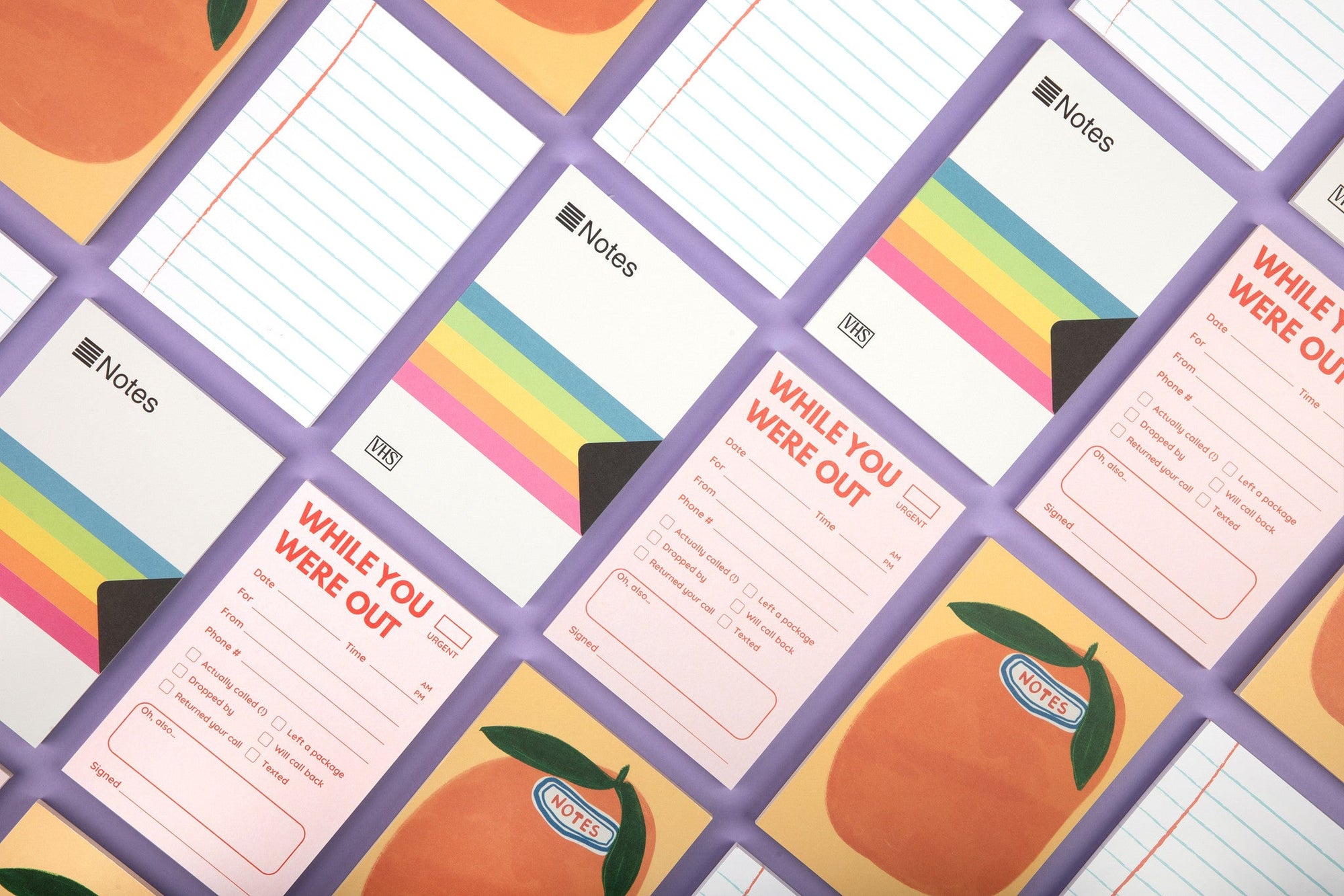 Grid layout of While You Were Out notepads with pink forms and rainbow striped backing
